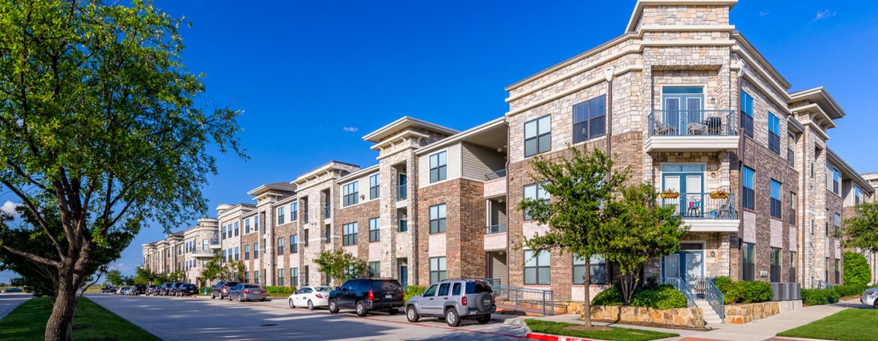 a building with cars parked in front